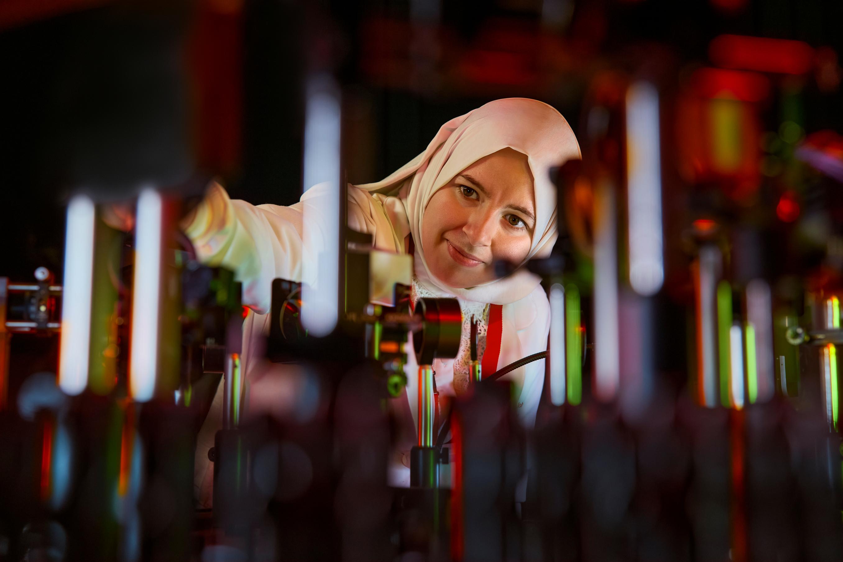 A close up of a Caucasian male surgeon scrubbing his hands with soap at a scrub sink in preparation for a surgical procedure.